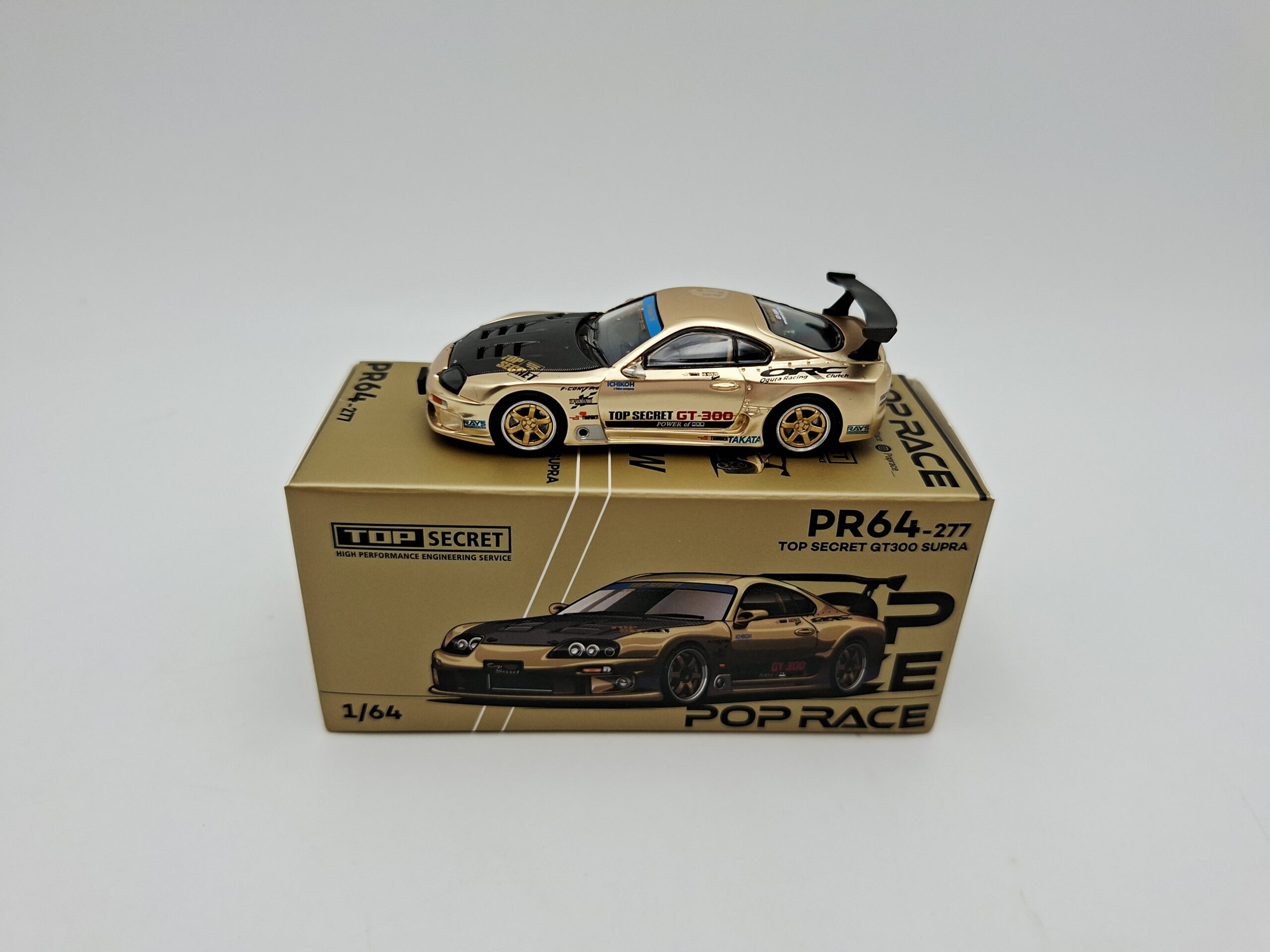 POP RACE 1:64 TOYOTA SUPRA TOP SECRET GT300 GOLD NOVEDAD